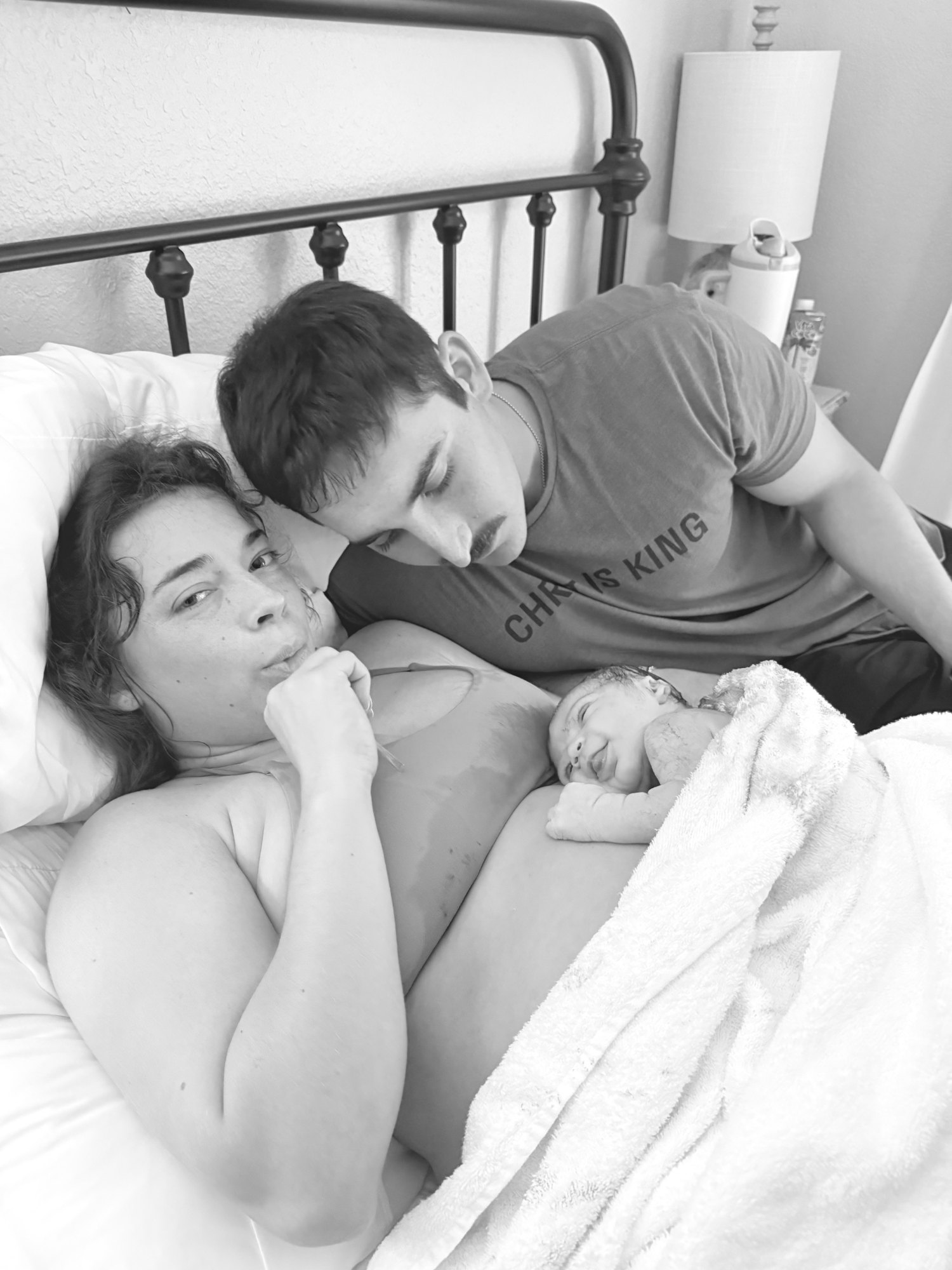 A new family resting together with their newborn after birth