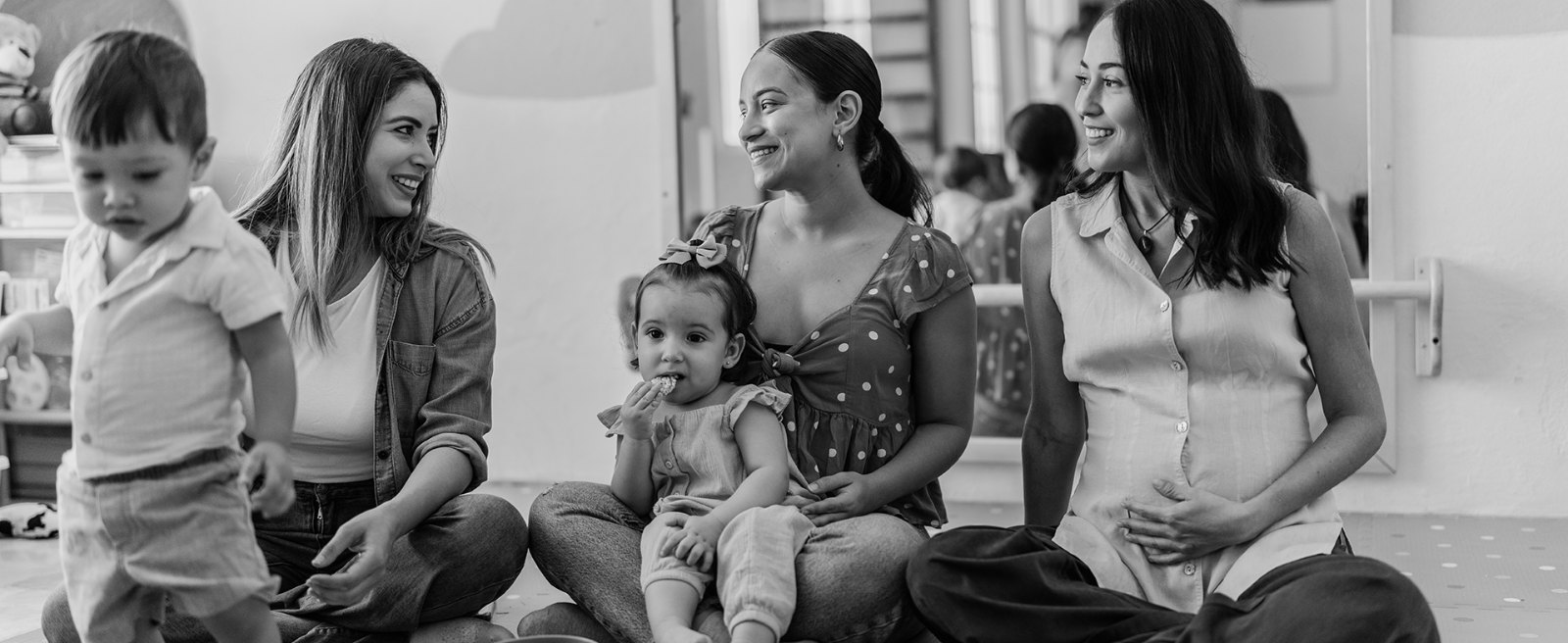 Mothers and young children gathered together at a community group